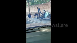 Motorist captures shopper pilfering fruit from Chinese vendor