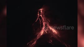 Glowing lava pours from Mayon Volcano summit crater as authorities warn of prolonged eruption