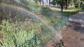 Heatwave and rainbows in Paris (hose water jet). Porte de Saint-Cloud, France. 14 june 2023