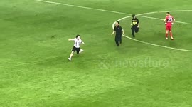 Teen fan rushes pitch to hug Lionel Messi, carried away by security