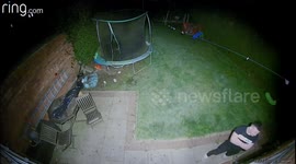 Terrifying moment 'drunk' man tries to smash his way into Manchester home using garden furniture