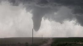Huge cone tornado swirls above fields in Texas