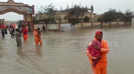 Heroic moment children are rescued from devastating floods in India