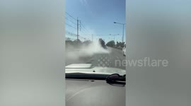 Truck covers drivers behind in thick plumes of exhaust fumes in Thailand