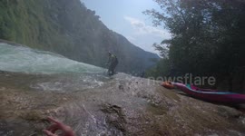 Kayaker running a crazy waterfall in southern Mexico/ Chiapas.