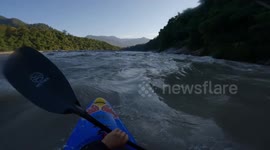 Kayaker running one of the biggest rapids in the world in North East India / Arunachal on the Siang river