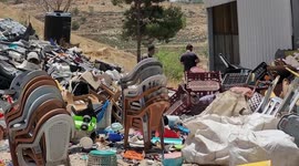 Palestinians work produce plastic chairs by recycling plastic waste in the village of Dura west of Hebron in the West Bank