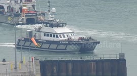 Border force vessel Typhoon returns to Dover with young children, women and men