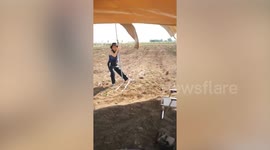 Tourists battle gales to set up tent at campsite