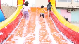 Palestinian children play at the