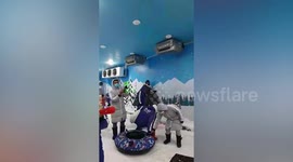 Youngster knocked down when he walks in front of oncoming sled at amusement park in Thailand