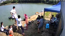 Chinese man's lightning reflexes save phone moments before river plunge