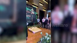 Delighted guests play parlour games at couple’s wedding