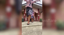 Student celebrating graduation stumbles down stairs in amusing photoshoot fail