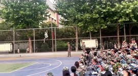 Military trainee unexpectedly scales playground fence during martial arts performance in China