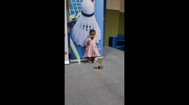 Cute little girl goes on podium to receive her badminton prize of her own  and her trophy watch what happens