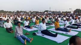 Almost 10,000 take part in stretches along India's Ganges to mark International Yoga Day