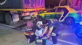 Taxi hits truck when cab driver reaches for his phone