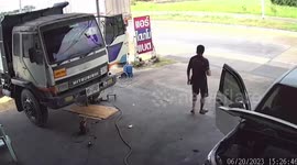 Truck swerves off slippery road when it dodges fallen motorcycle