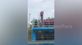 Trainee cop slips  from diving board into pool during survival seminar