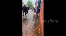Liquid football! Fan showers as rain pours from stadium after Scotland match suspended due to waterlogged pitch