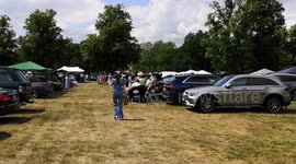 On a hot summer's day people attending Royal Ascot races make the most of the good weather with a nice picnic