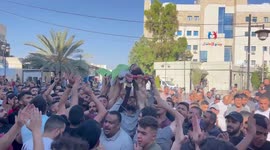 Mourners attend the funeral of the Palestinian Omar Qateen, 27, who was killed by Israeli bullets during Israeli settlers raid