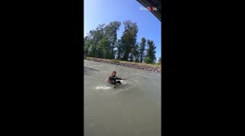 Man loses his grip while wakeboarding and goes with the river's flow