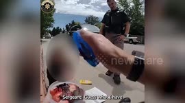 Police officer comforts girl, five, found alone and barefoot by the road