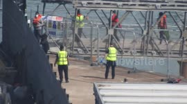 Border Force organising Asylum seekers after being unloading off BF Volunteer