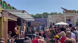 Crowds revel in Glastonbury sun dancing to The Showhawk Duo playing Vengaboys