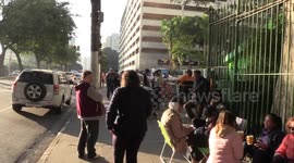 The queue for tickets to the Taylor Swift concert is reinforced by police surveillance, and money changers are detained in Sao Paulo, Brazil