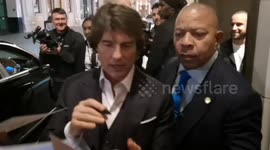 Tom Cruise signs autographs as he arrives at London's Cafe Royal for after-party of film premiere