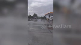 Freak tornado damages fuel station as it rips through city in the Philippines