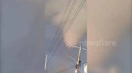 Debris flies across road as large tornado tears through city in the Philippines