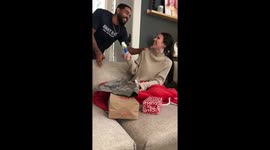 Man laces up with surge of excitement as elated girlfriend announces her pregnancy to him