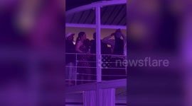 Superstar Rihanna shows off her growing baby bump in tight-fitting dress at Cannes Lions festival in France - while watching boyfriend A$AP Rocky perform