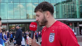 England fan plays a trivia game before kickoff at Old Trafford