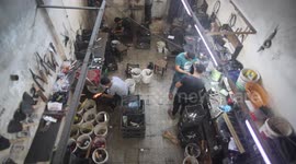 Men sharpen the knives before the upcoming Eid al-Adha in Gaza City