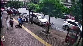 Elderly Chinese man escapes serious injuries in sudden sidewalk sinkhole mishap