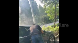 Car engulfs in flames moments after good Samaritan rescues unconscious driver in China