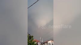 Tornado collects debris as terrified residents watch in the Philippines