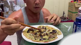Taiwanese man eats stomach-churning omelette made from cockroaches