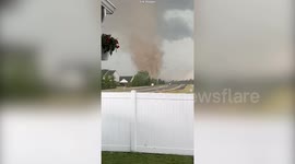 Huge tornado rips through suburban areas in Indiana sending debris into the air
