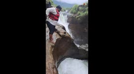 Indian man's trip to secret waterfall becomes memorable for the wrong reason *He SLIPPED!*