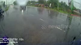 Quick-thinking driver pulls away as out-of-control truck swerves towards him on wet road