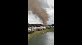 Terrifying tornado rips through Indiana neighborhood, tearing roof of building