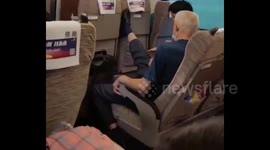Elderly Chinese man repeatedly kicks reclining front seat back on train