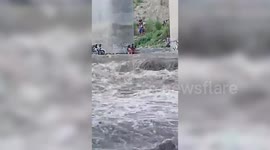 Stranded family rescued when river suddenly swells during picnic