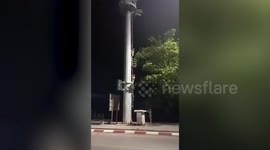 Drunk tourists spark outrage clambering up tsunami warning tower in southern Thailand